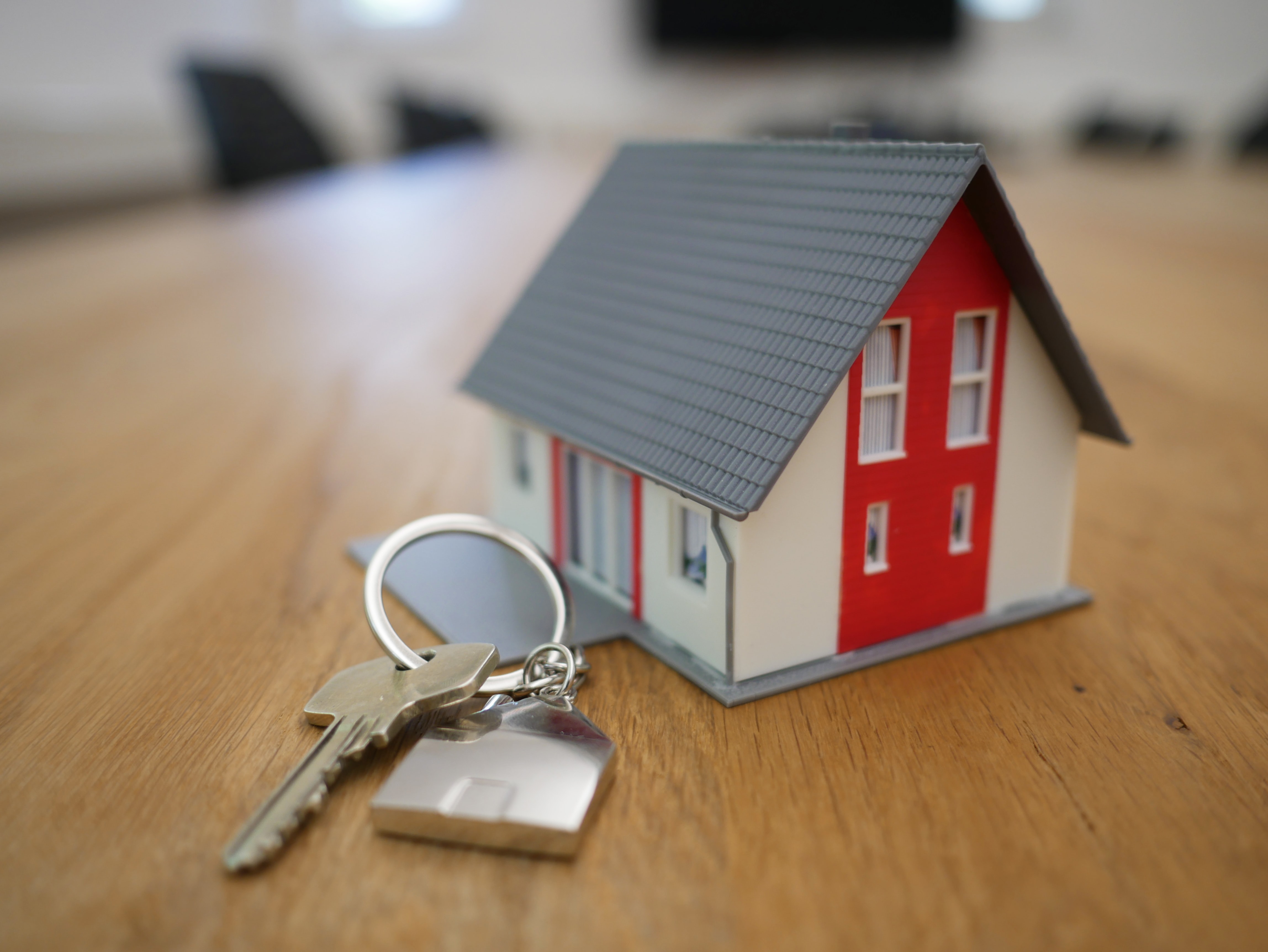 Key Next to White & Red House Miniature